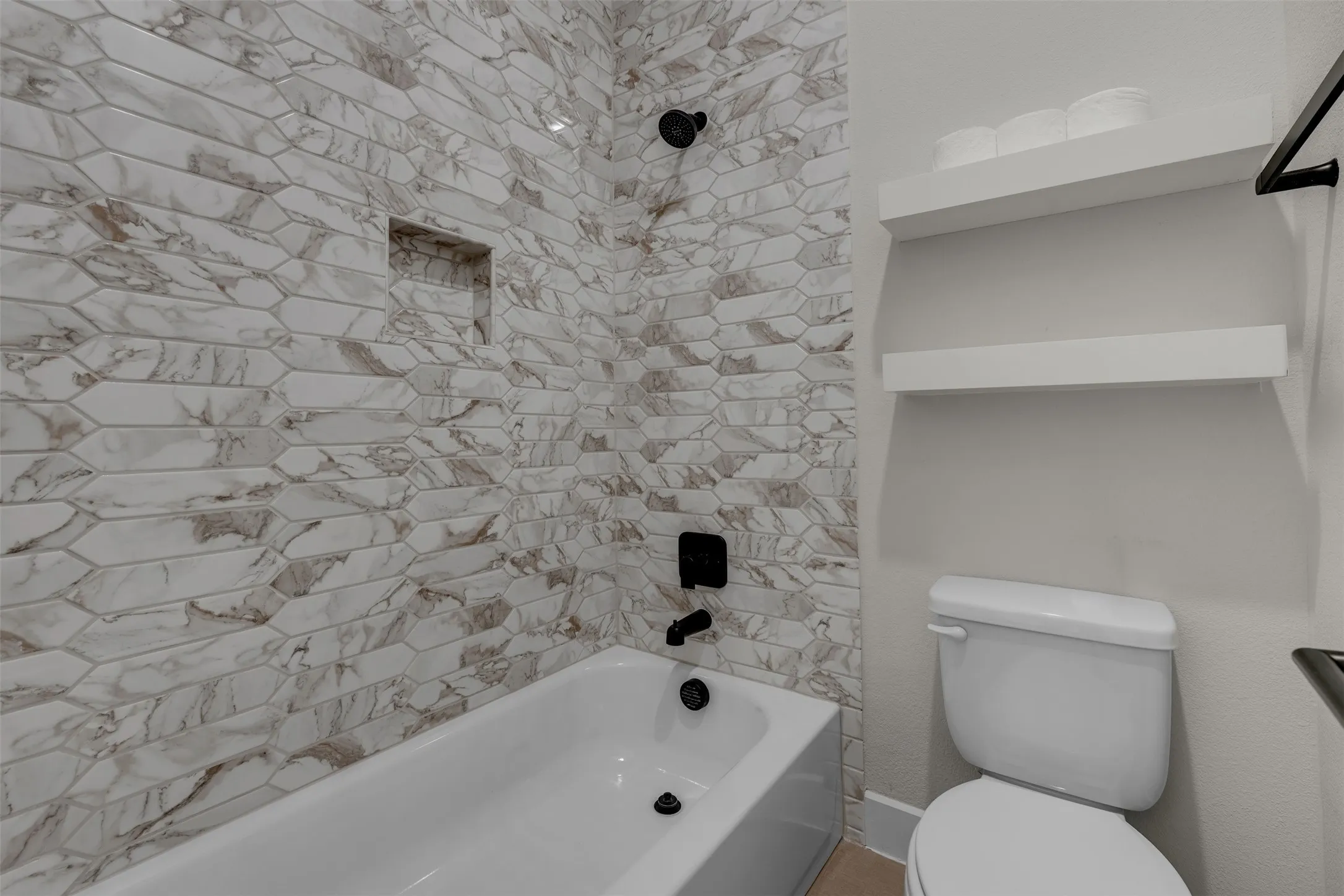 Separate Wet Areas in Hall Bath in Bedroom Wing. Tile to ceiling.