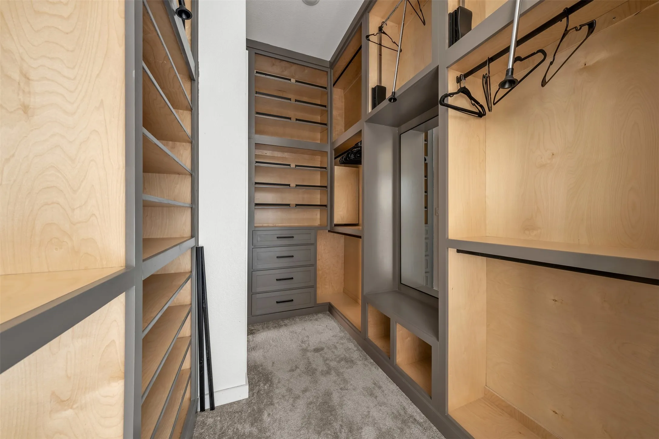 Primary Ensuite Custom Cabinetry opens to Utility Room.