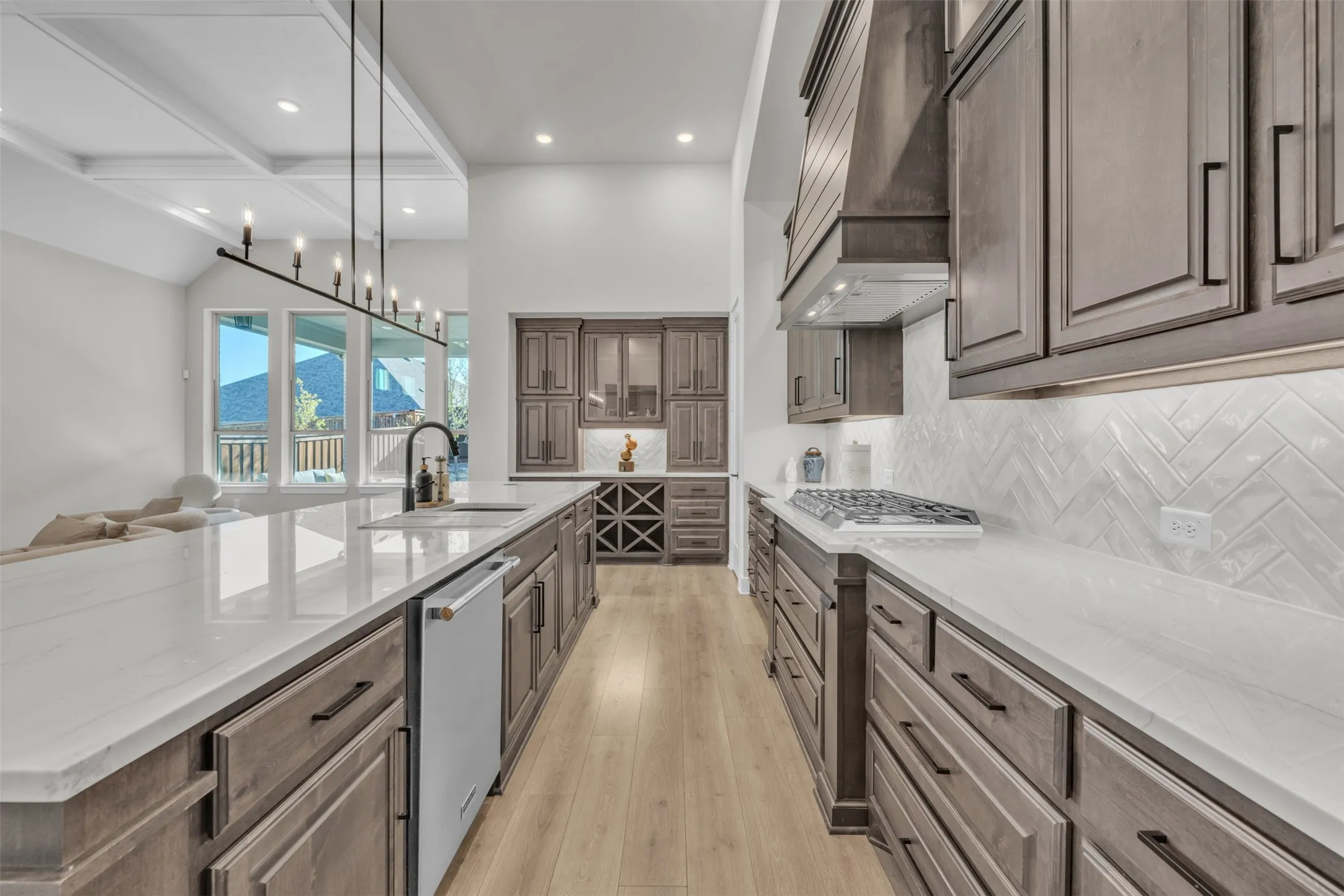 Drawers instead of lower cabinets. Designer Single Sink and upgraded hardware.