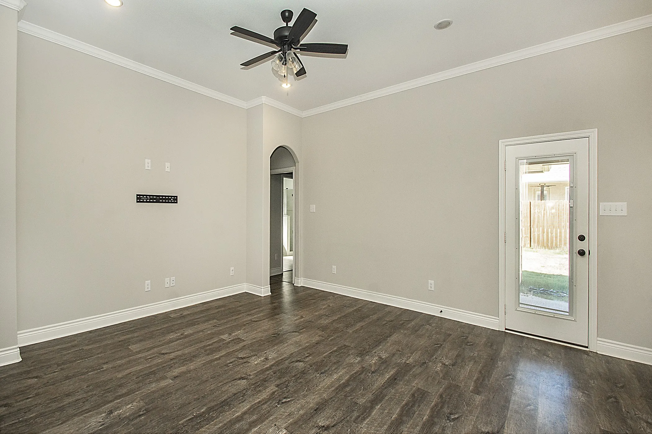 Wood-finish flooring with crisp white baseboards