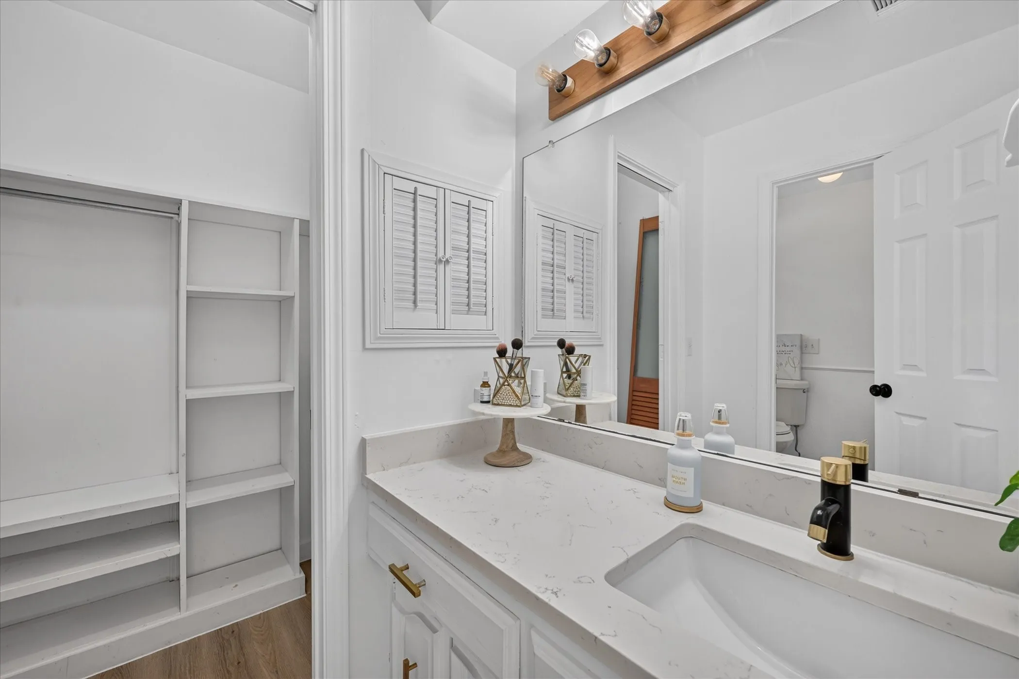 Master bathroom with second closet.