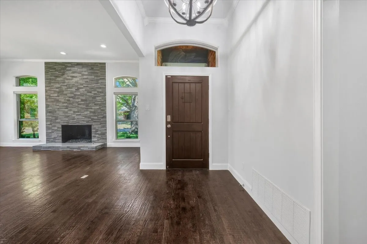 Hand-scraped hardwood flooring throughout