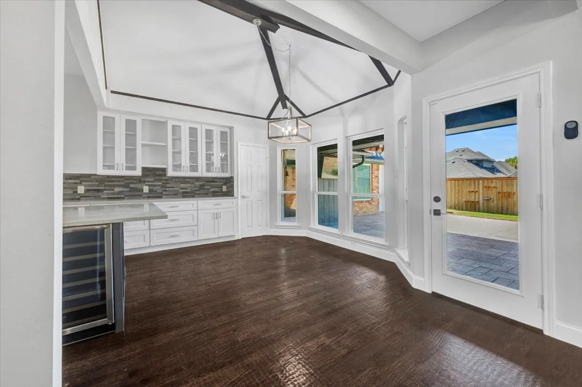 Breakfast area in eat-in kitchen open to the living spaces and dining room