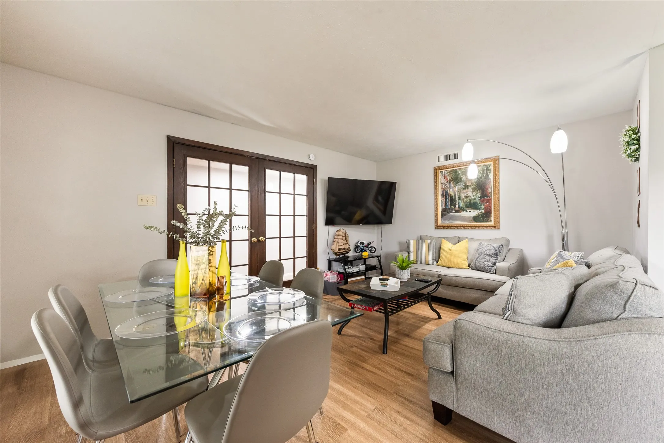 Living area with french doors and wood finished floors