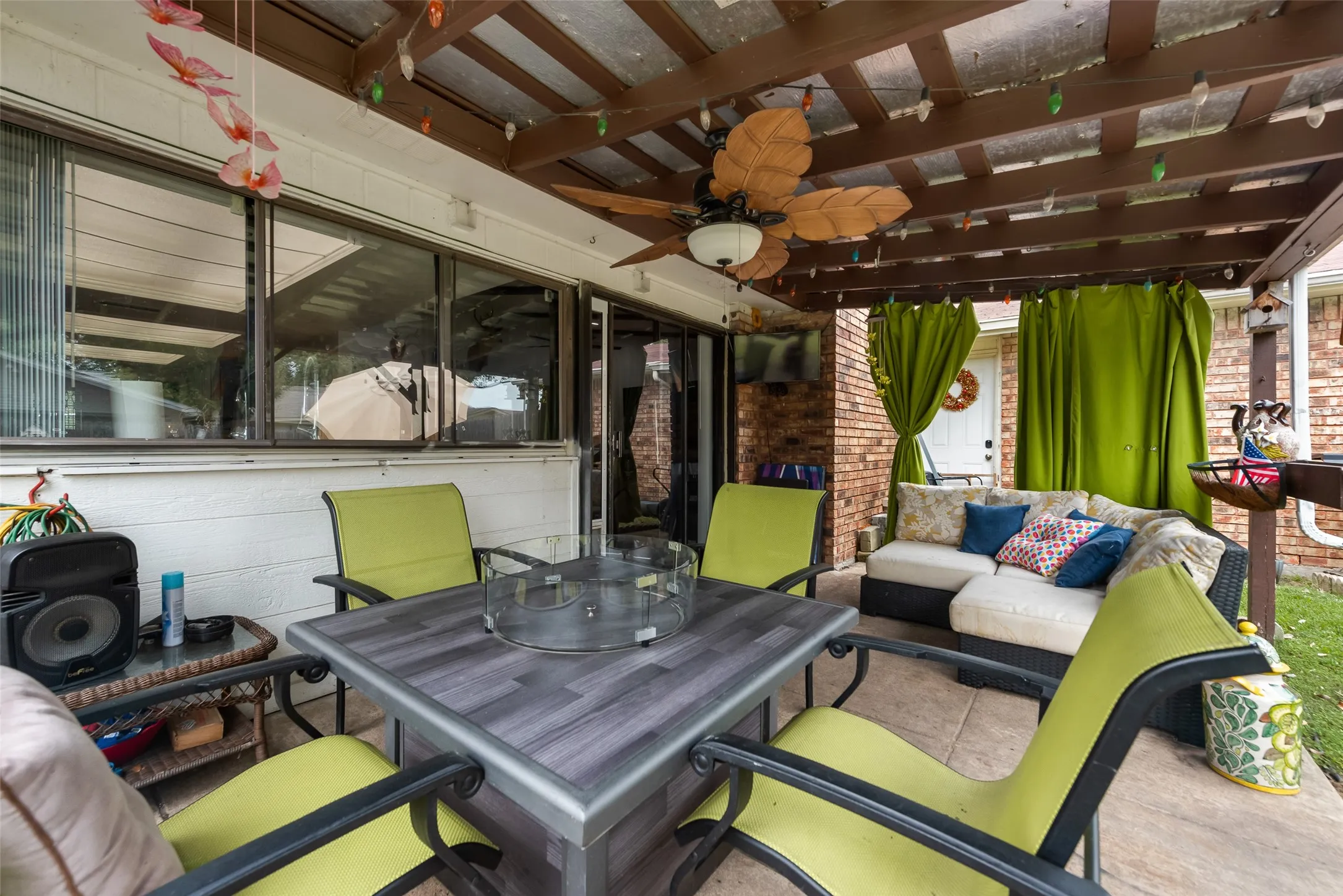 View of patio / terrace featuring outdoor dining space, ceiling fan, and outdoor lounge area