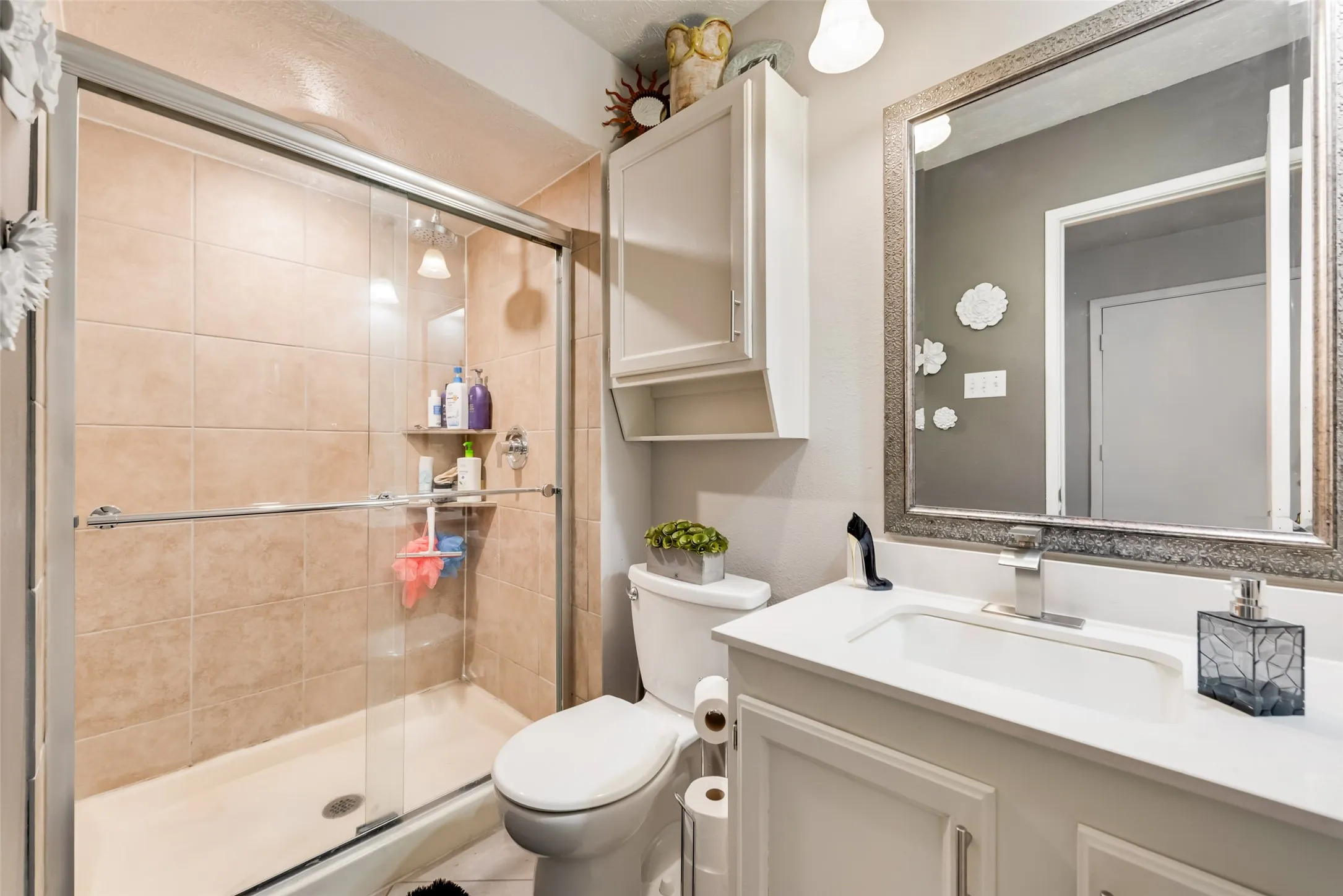 Full bath featuring vanity and a stall shower