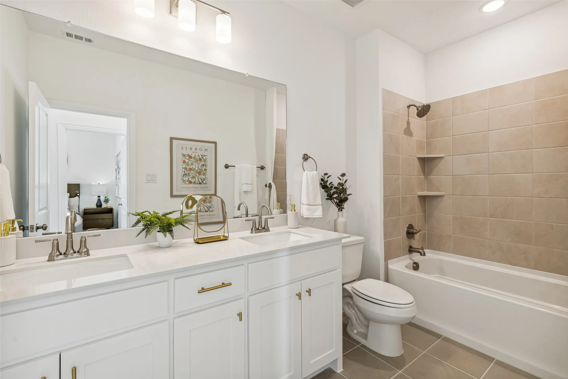 Friends and family will feel right at home in this thoughtfully designed, beautifully finished guest bath.