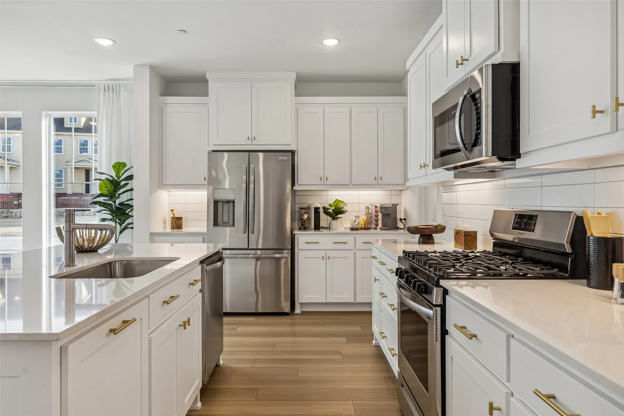 Beautiful cabinetry, gorgeous countertops and designer backsplash effortlessly pair with contemporary stainless steel to create a dream kitchen for the ages!