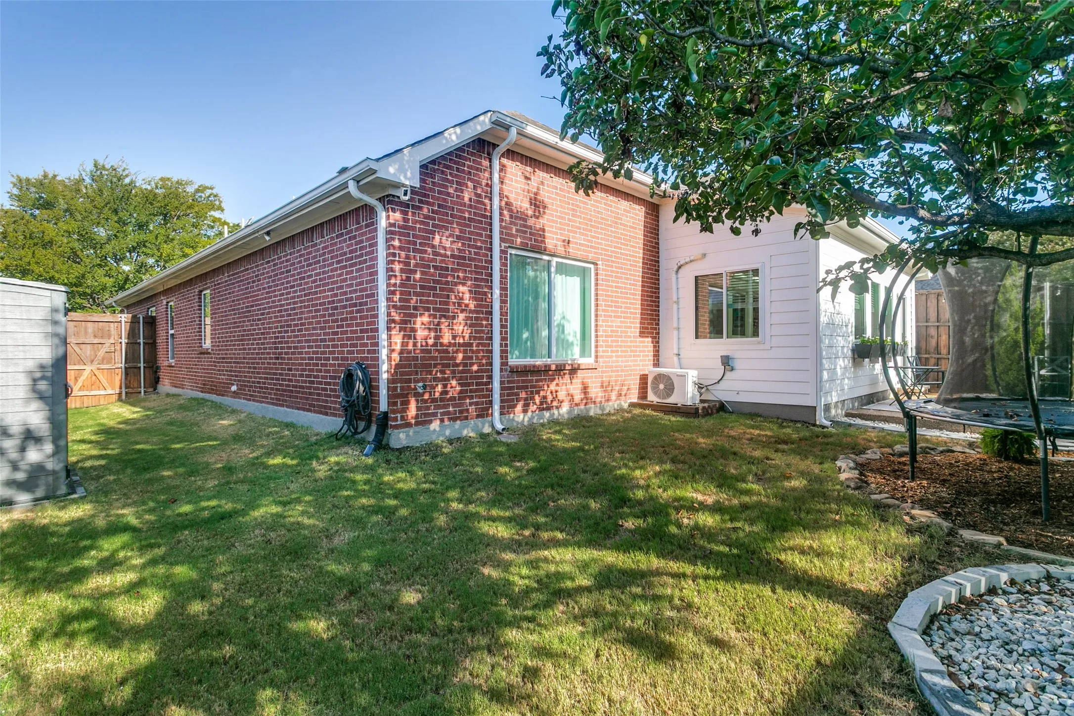 Brick and siding exterior with a pitched roof