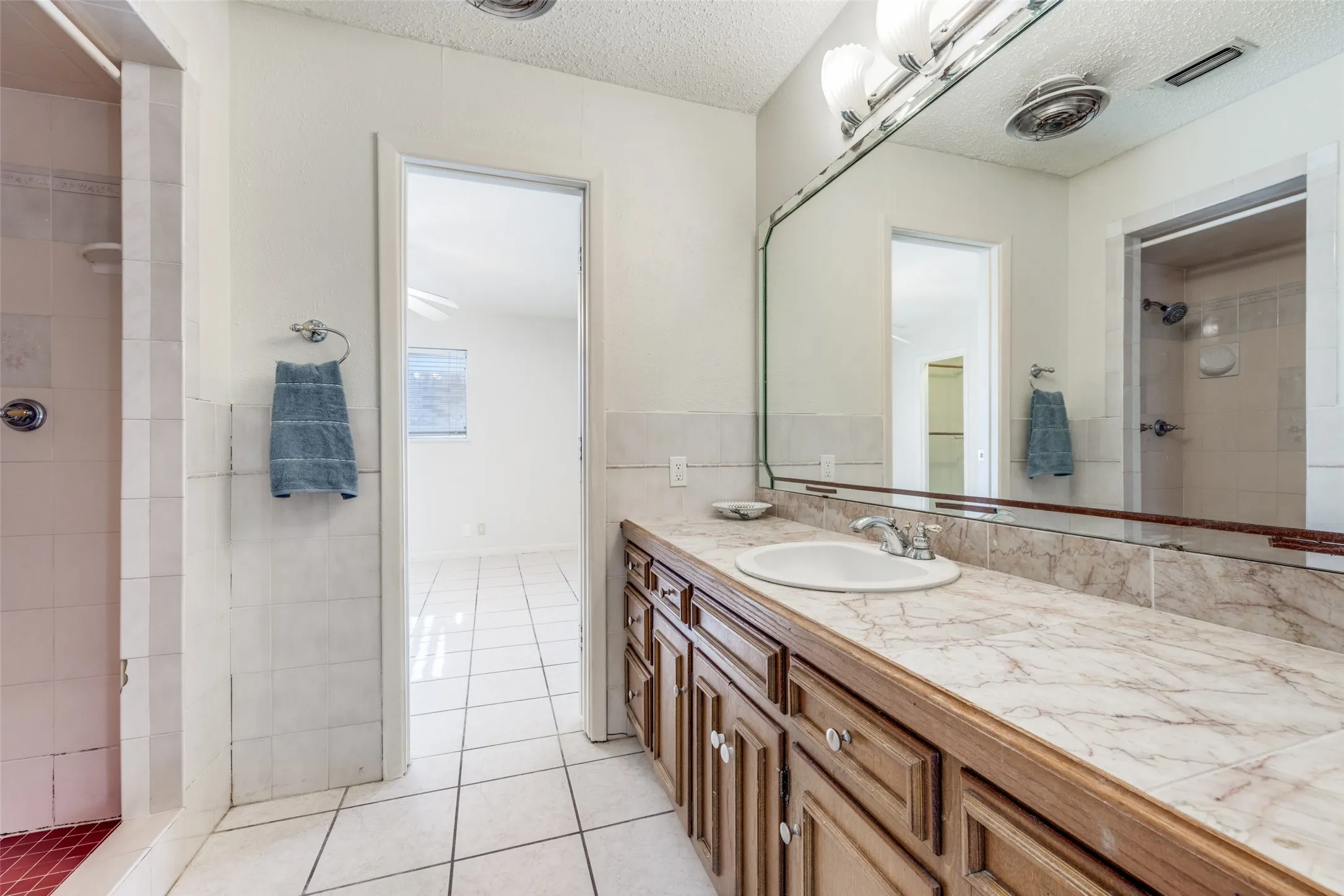 View of connecting bath with walkin shower.