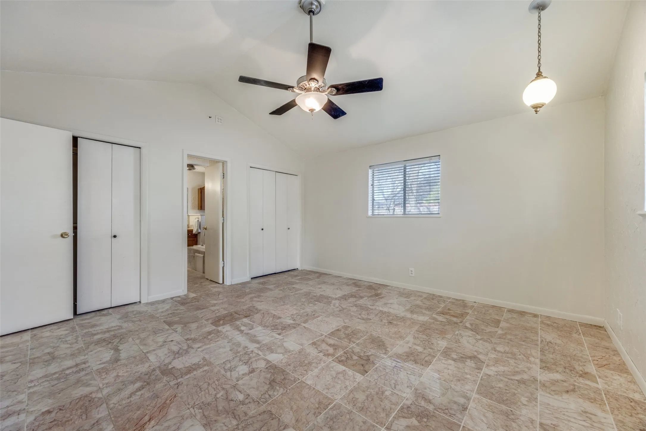 View of master with dual closets and entrance to master bath.