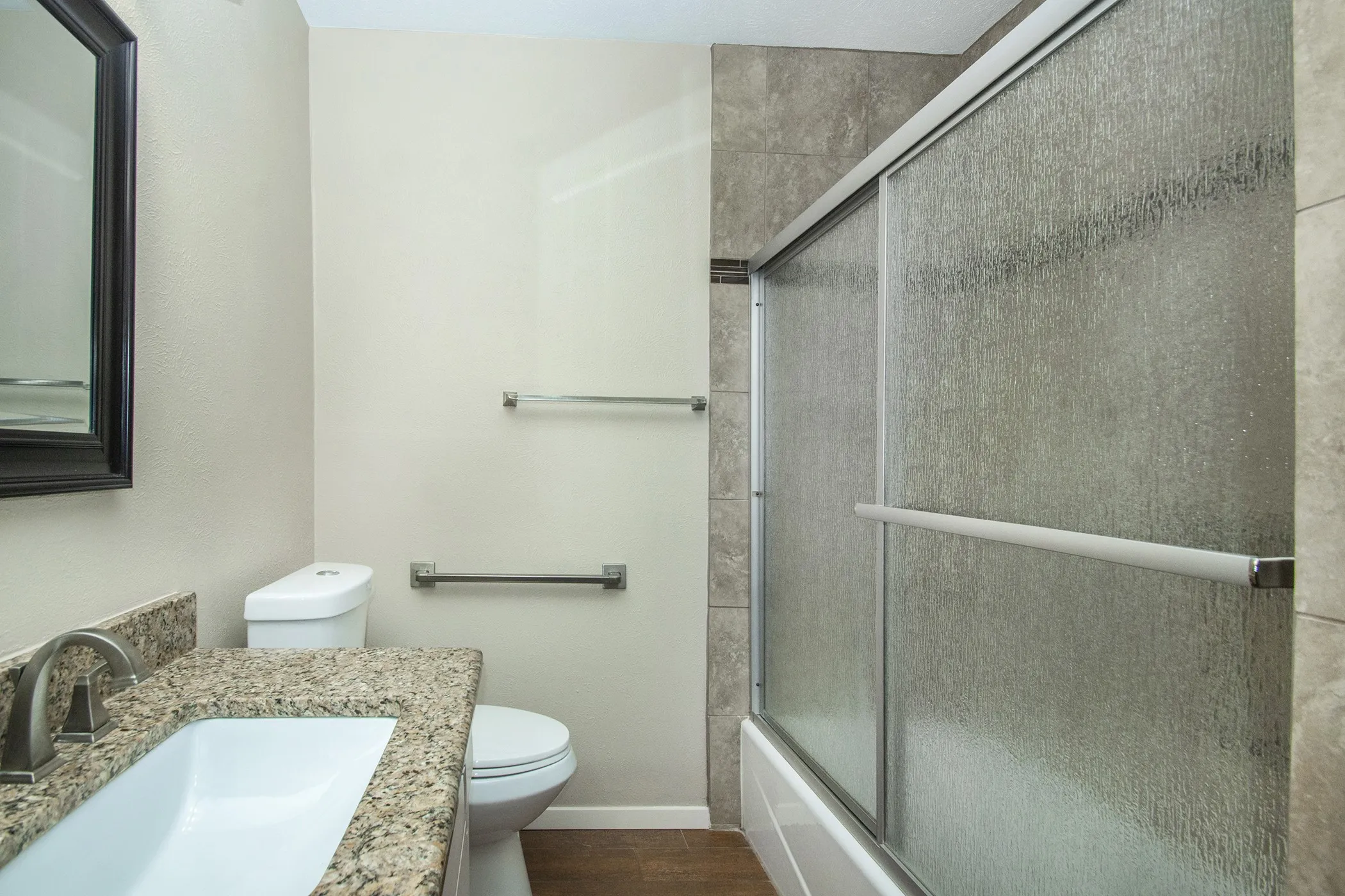Granite-finish vanity with an undermount sink and brushed nickel faucet