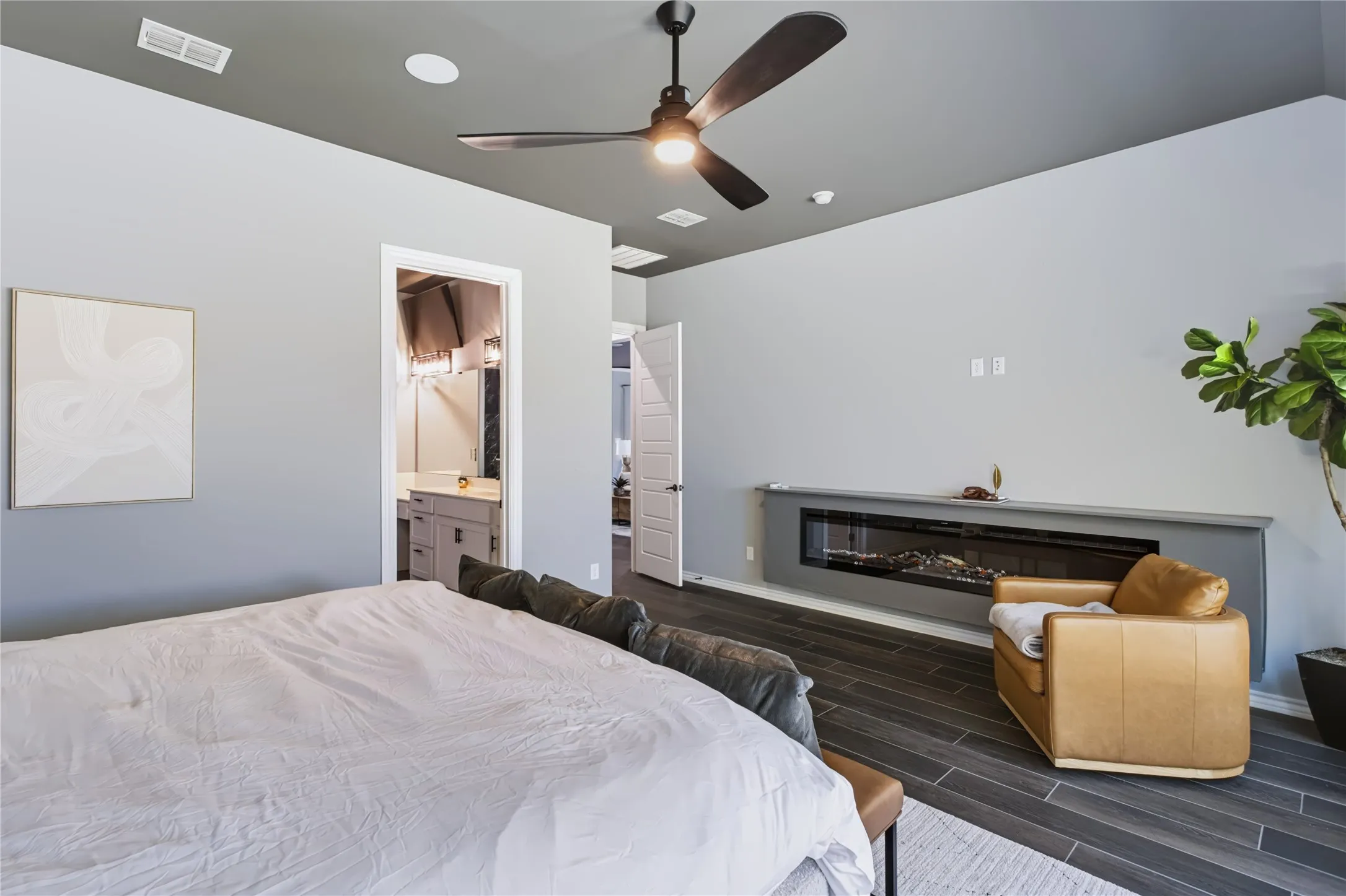 Wood-finish flooring with a modern linear fireplace