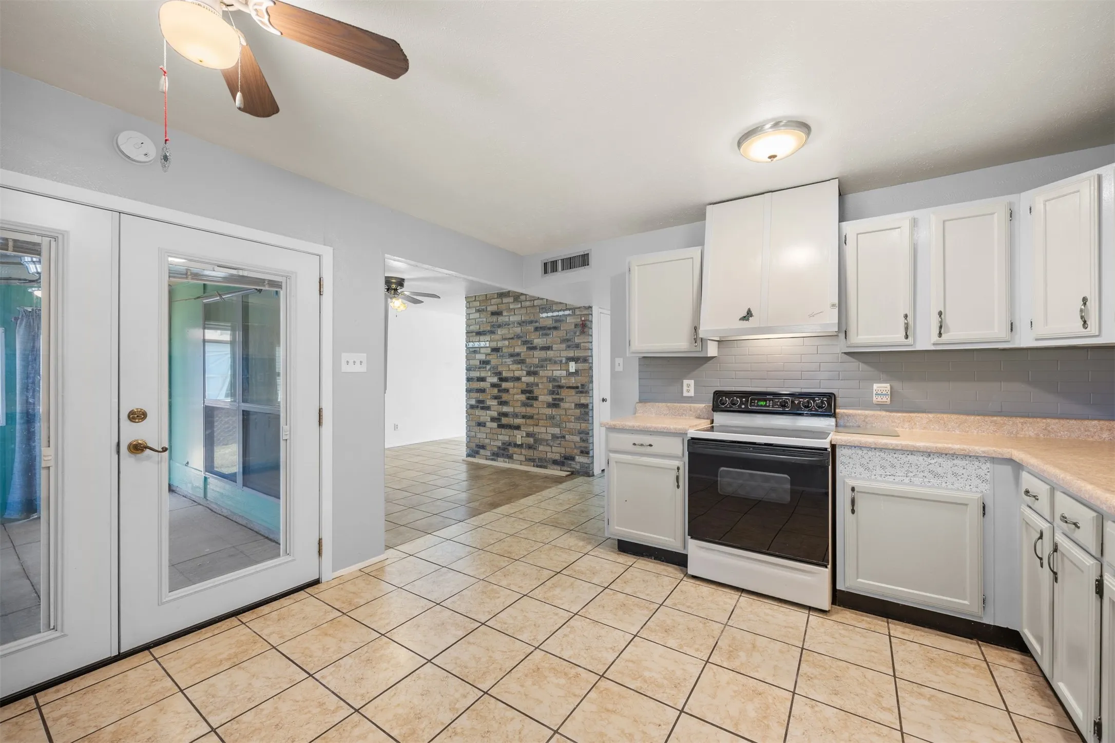 Convenient access from the kitchen leads directly to the outdoor patio