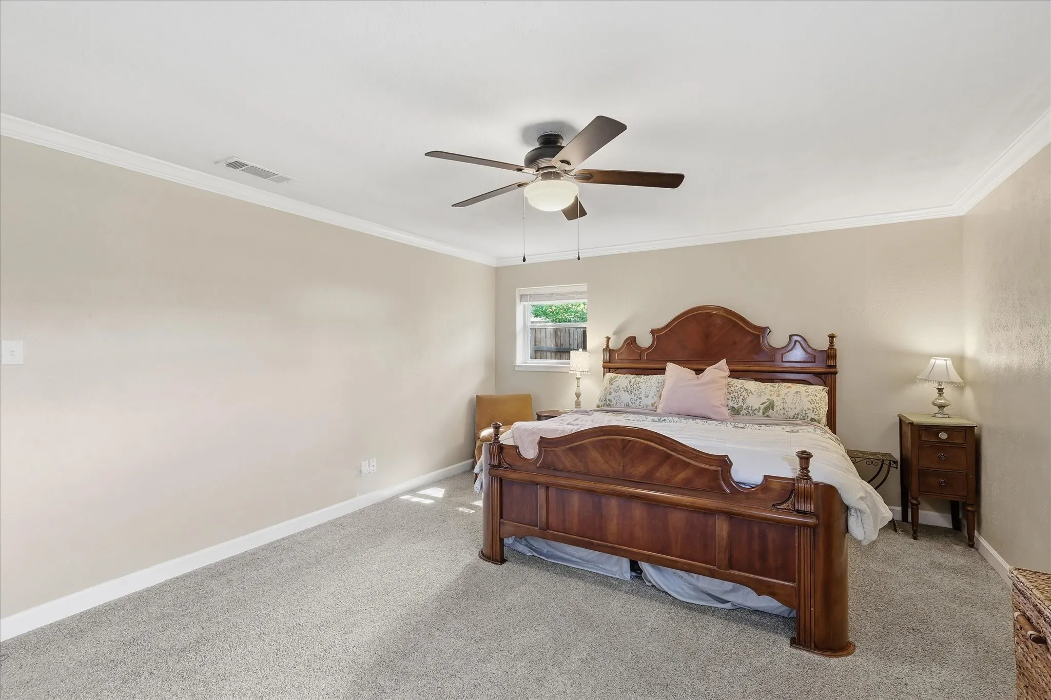 Recessed lighting, crown molding, ceiling fan, and carpeted flooring