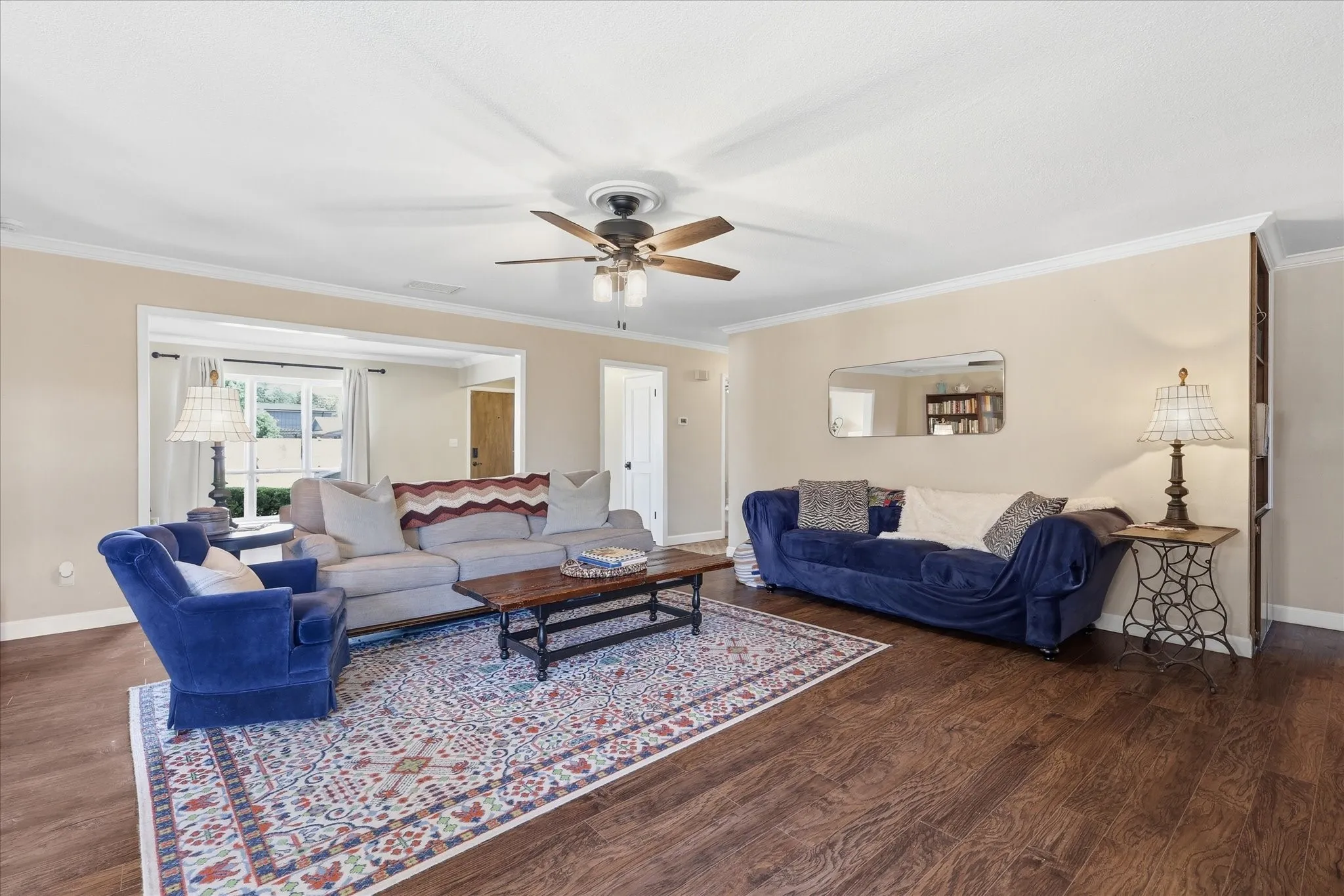 Wood-finish flooring, crown molding, ceiling fan, and recessed​​‌​​​​‌​​‌‌​‌‌​​​‌‌​‌​‌​‌​​​‌​​ opening