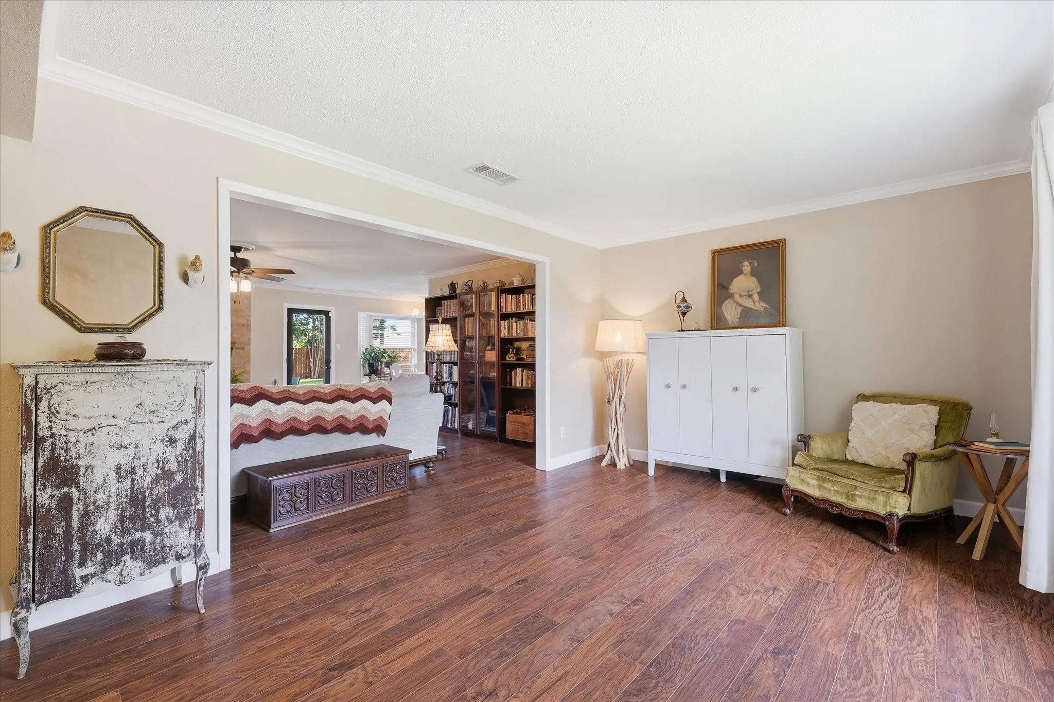 Warm wood-finish flooring extending through the space