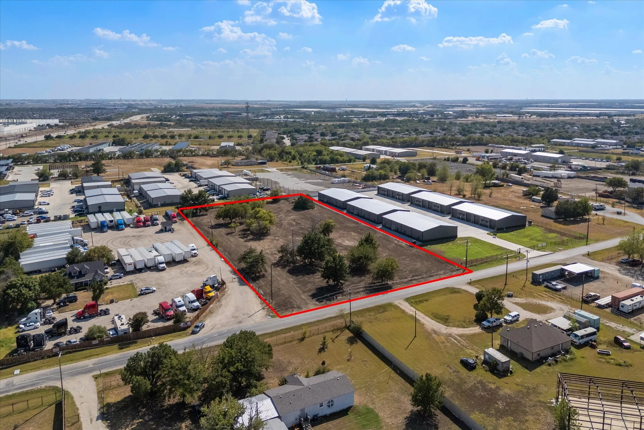 Expansive undeveloped land with visible road frontage