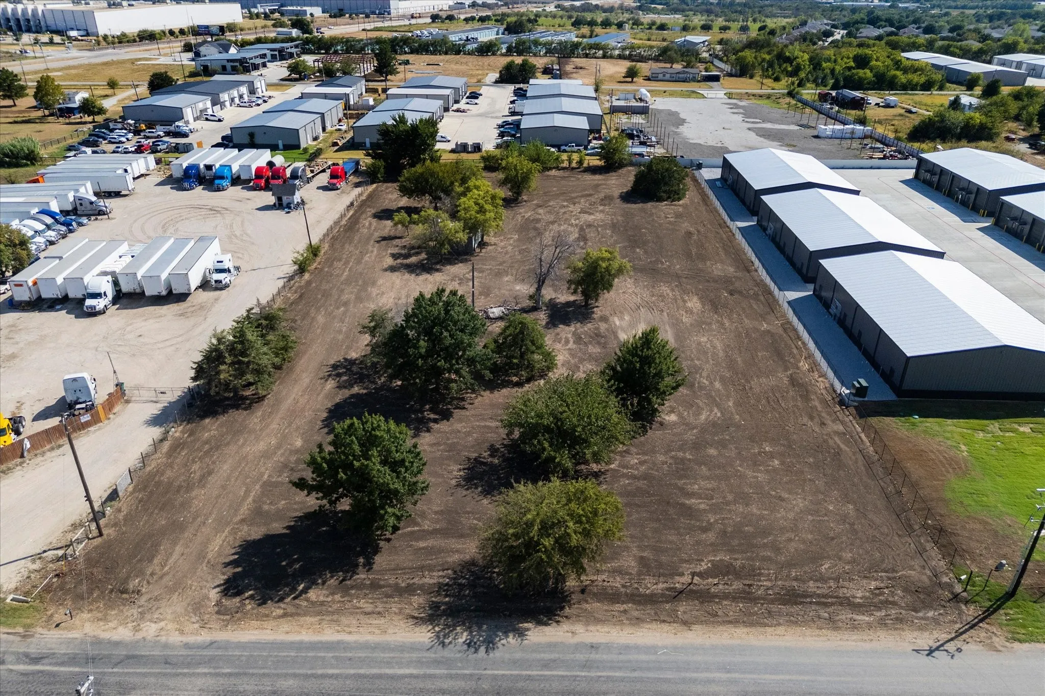 Cleared lot with mature trees and direct road frontage