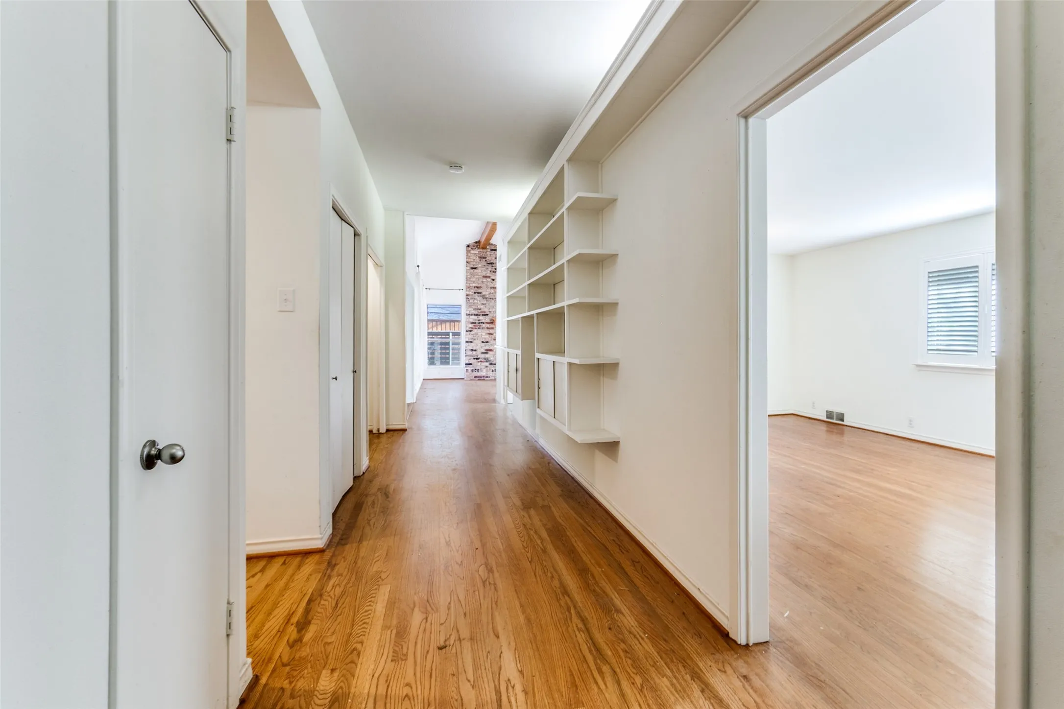 This photo was taken with back to the front door looking down hallway; LR and DR to the right.