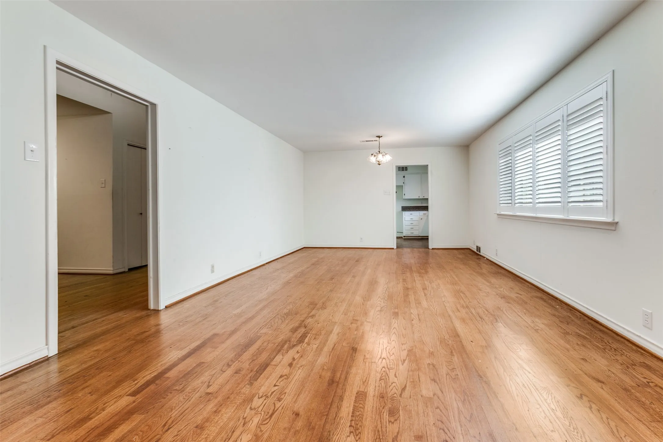 Beautiful hardwoods; kitchen in background