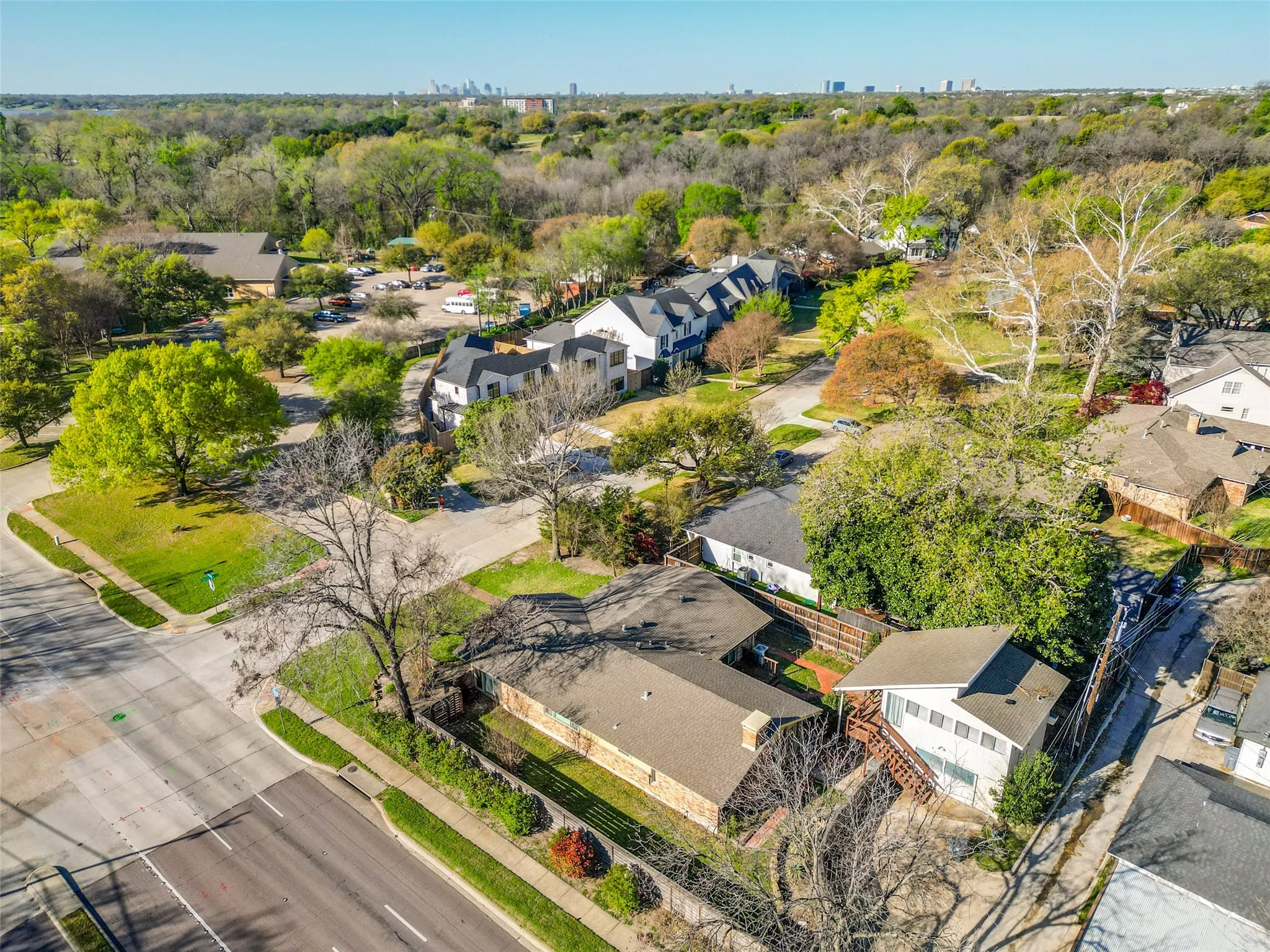 View is on the east side of Audelia Road looking west; subject property in foreground and CBD in background.