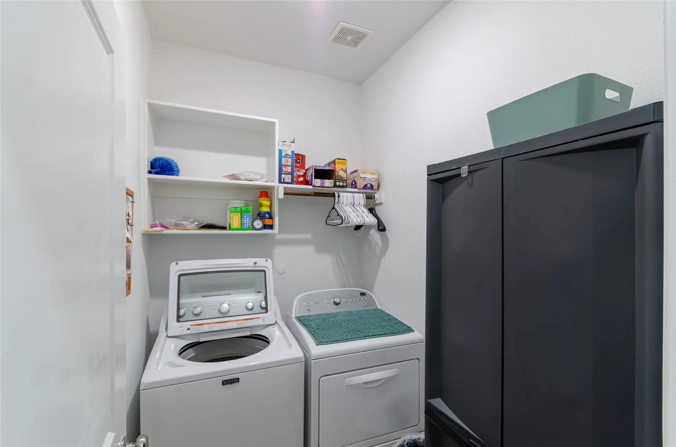 Built-in shelving and a clothing rod for organization