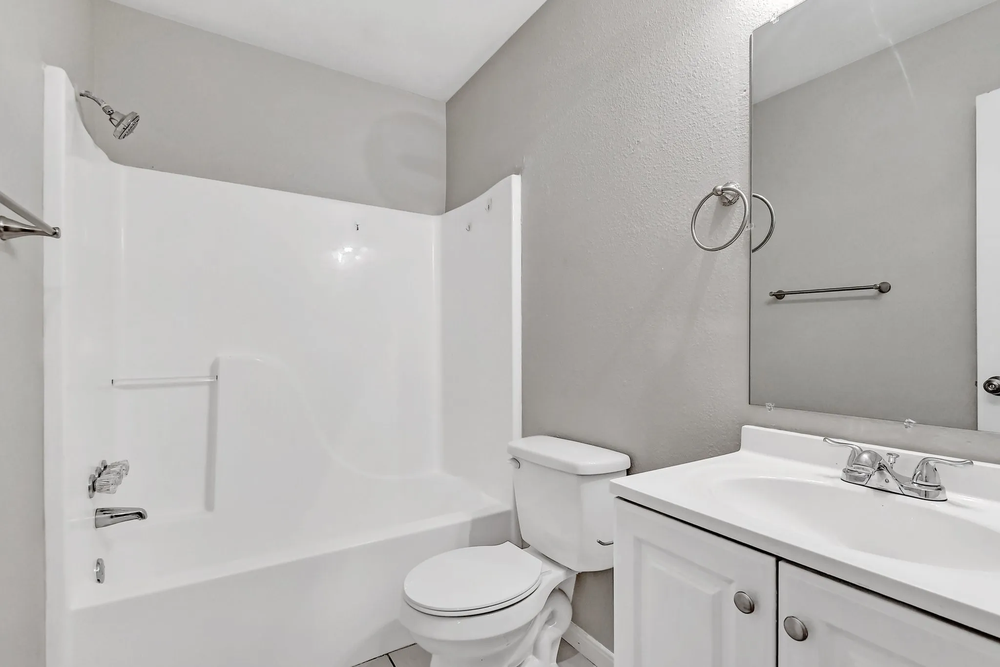 Full bath featuring vanity,  shower combination, and toilet