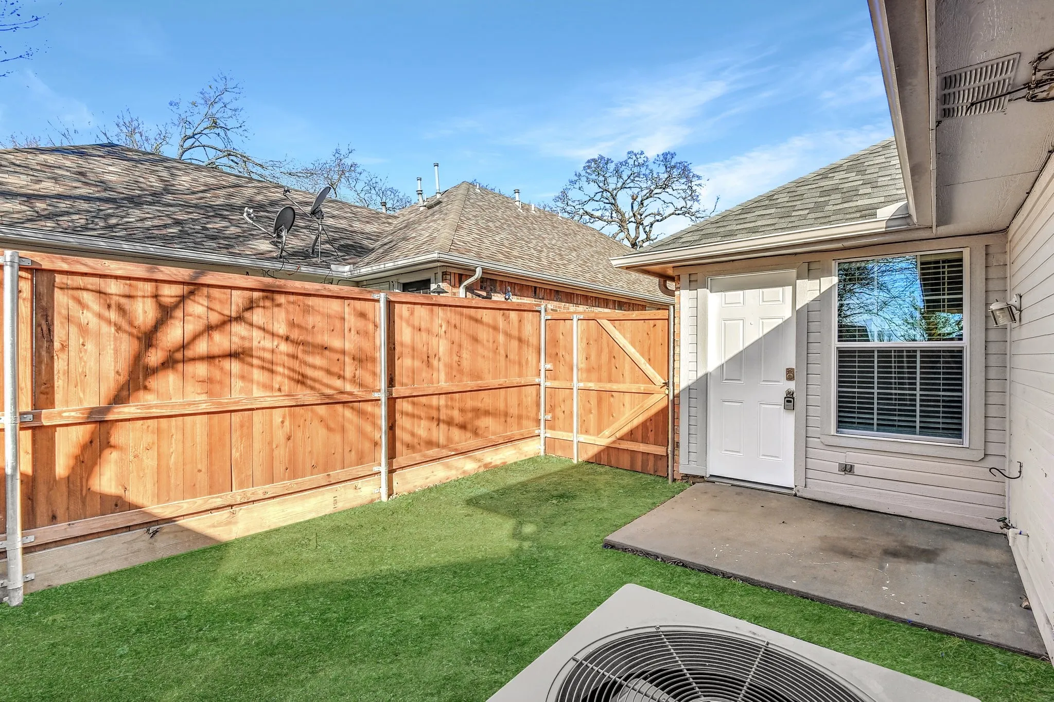 View of yard with a patio area and fence