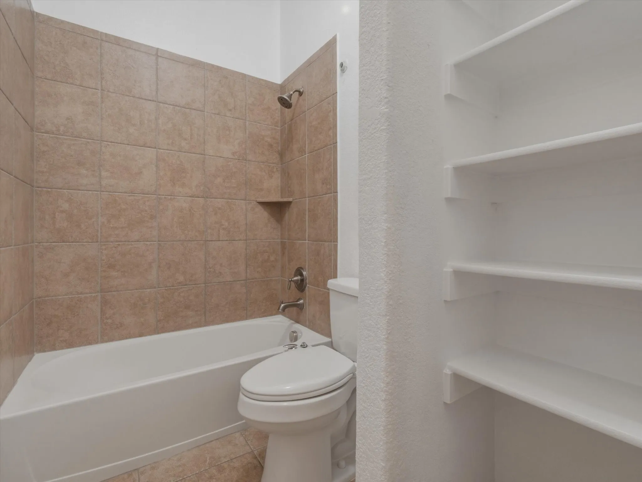 Tub with brushed nickel fixtures