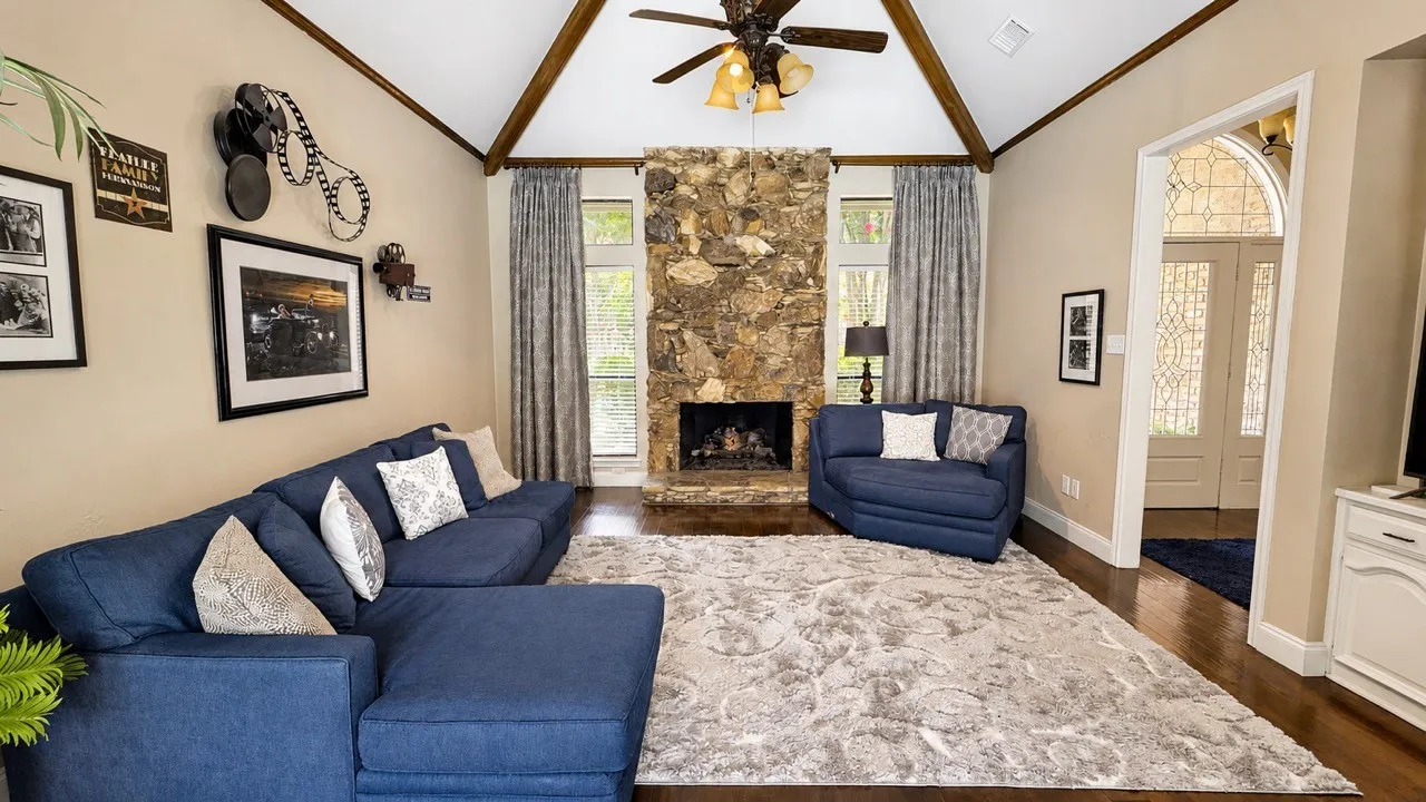 Family room just off the entry...note the tall, vaulted beamed ceiling.