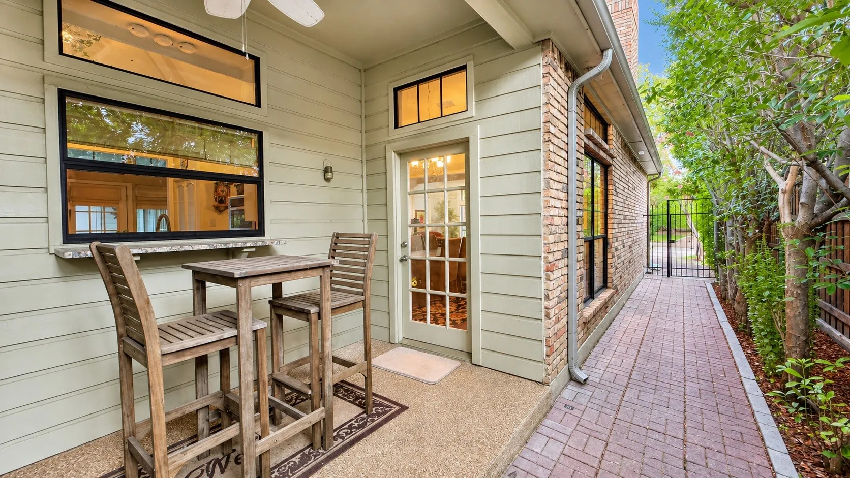 Charming patio off the dining room with connected gas grille. Service window to the kitchen