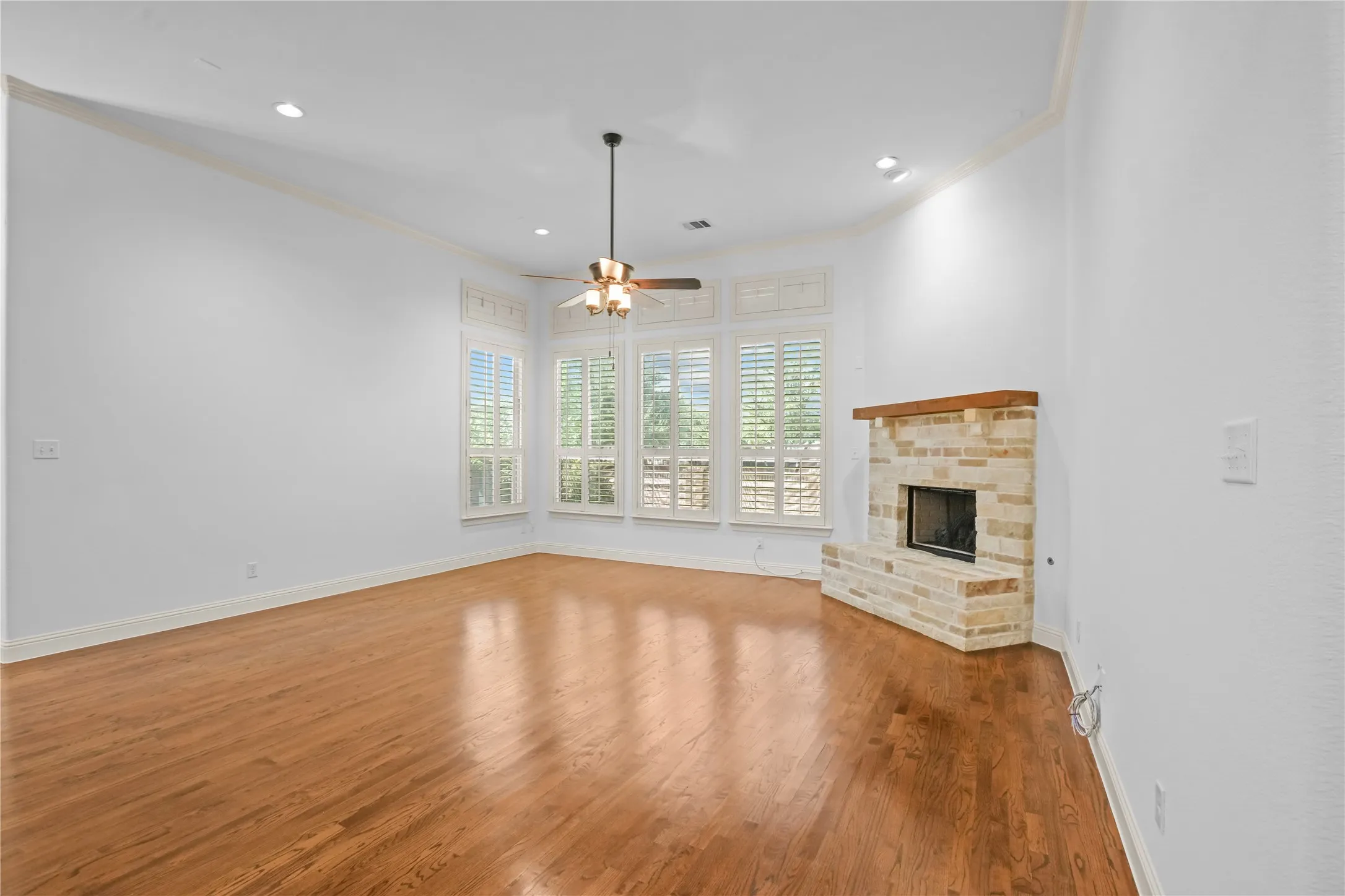 Family room is open to the kitchen.  Corner stone fireplace with gas logs and starter.
