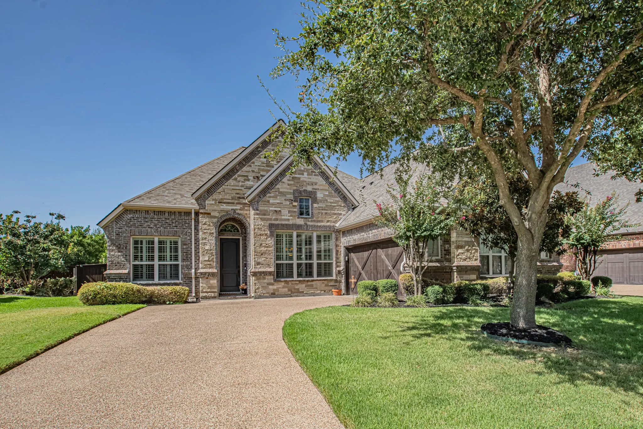 Stone and brick exterior with a gabled roof