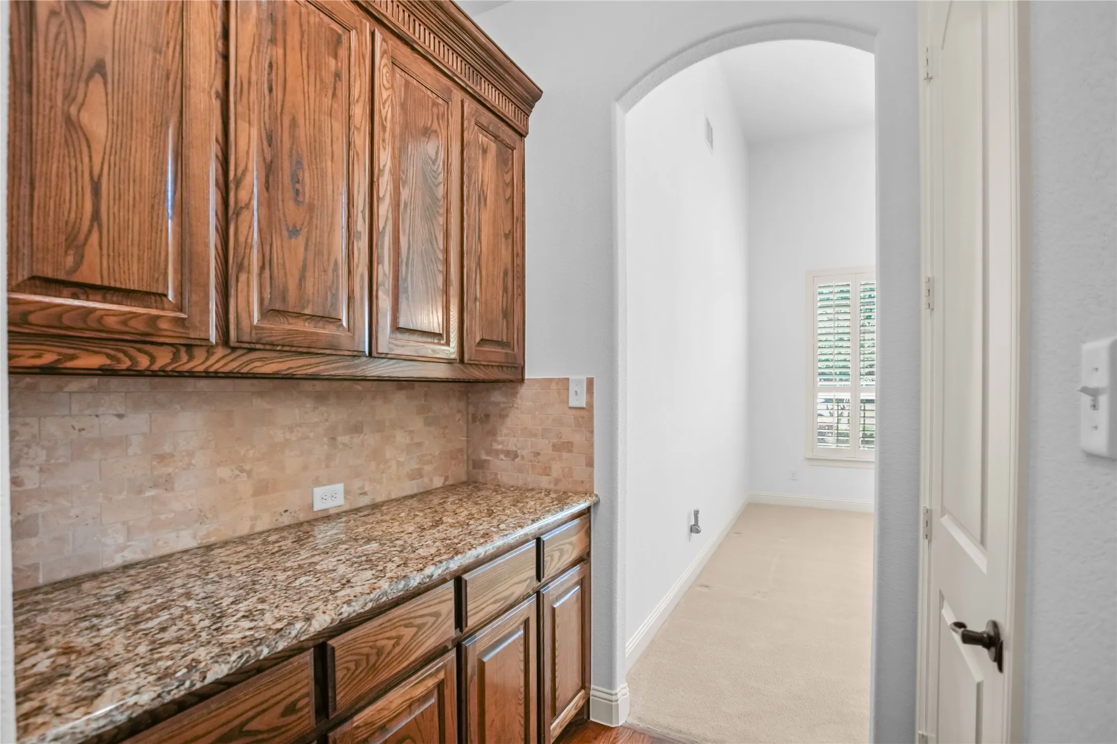 Butlers pantry between kitchen and formal dining room.