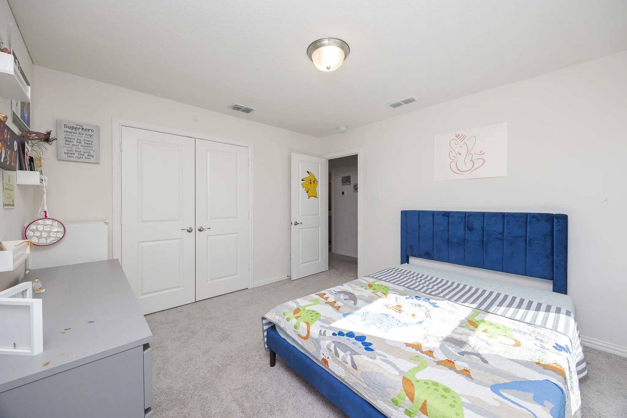 Wall-to-wall carpeted flooring, white interior doors, and a ceiling-mounted light fixture