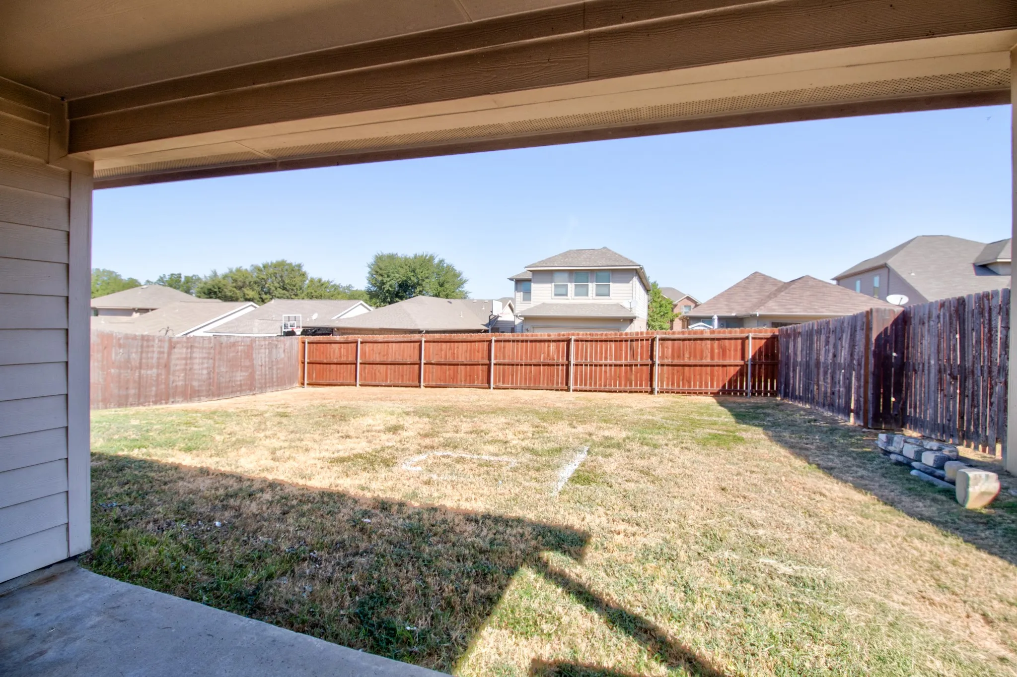 Back patio view into the fenced back yard!