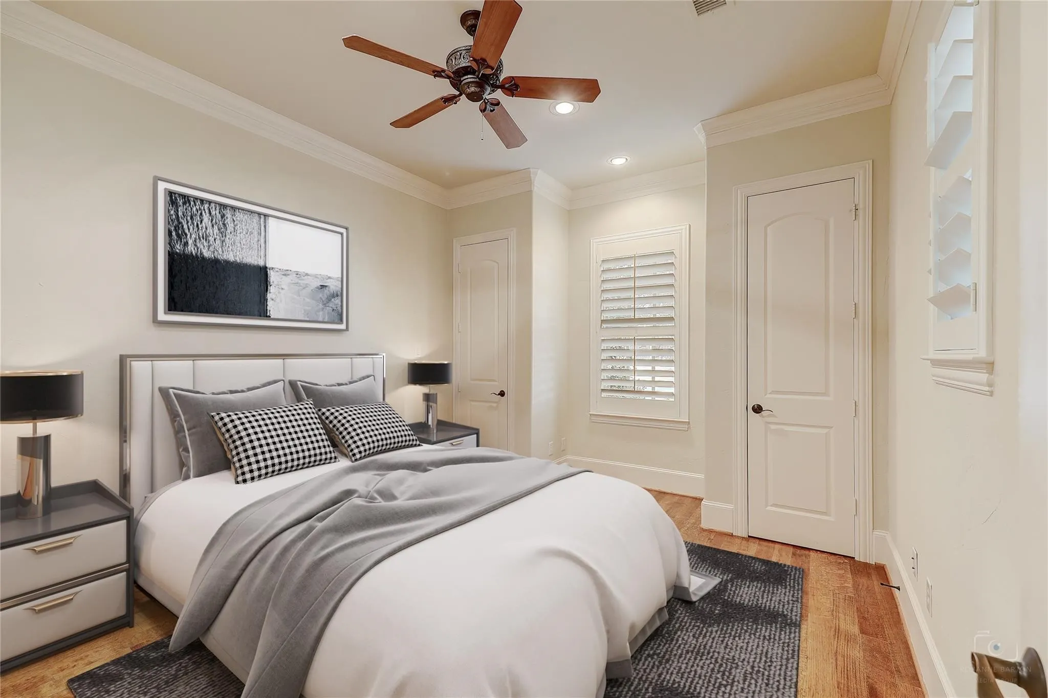 Wood-finish flooring, crown molding, ceiling fan, recessed lighting, and plantation shutters
