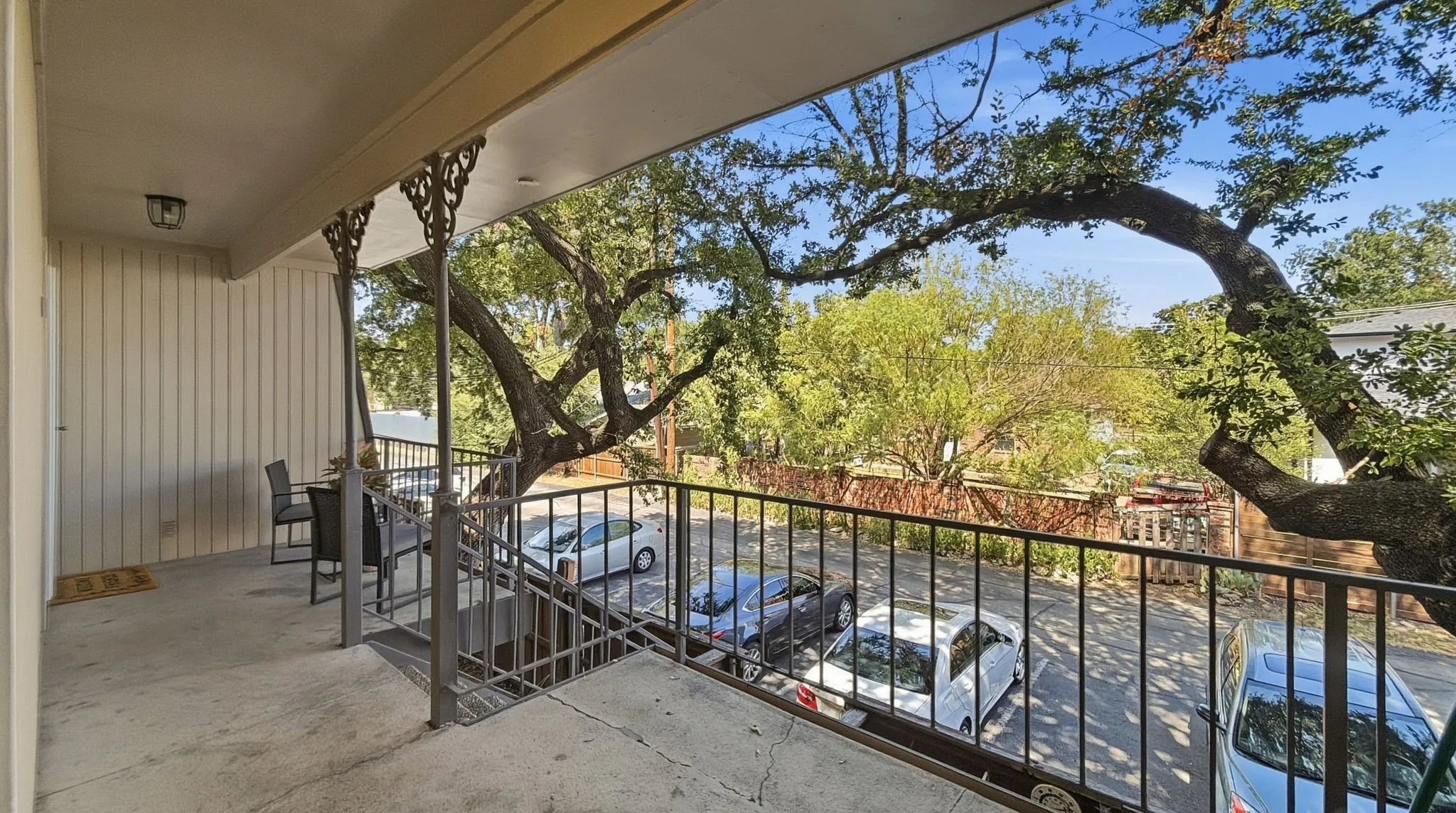 Covered patio in back near parking carport