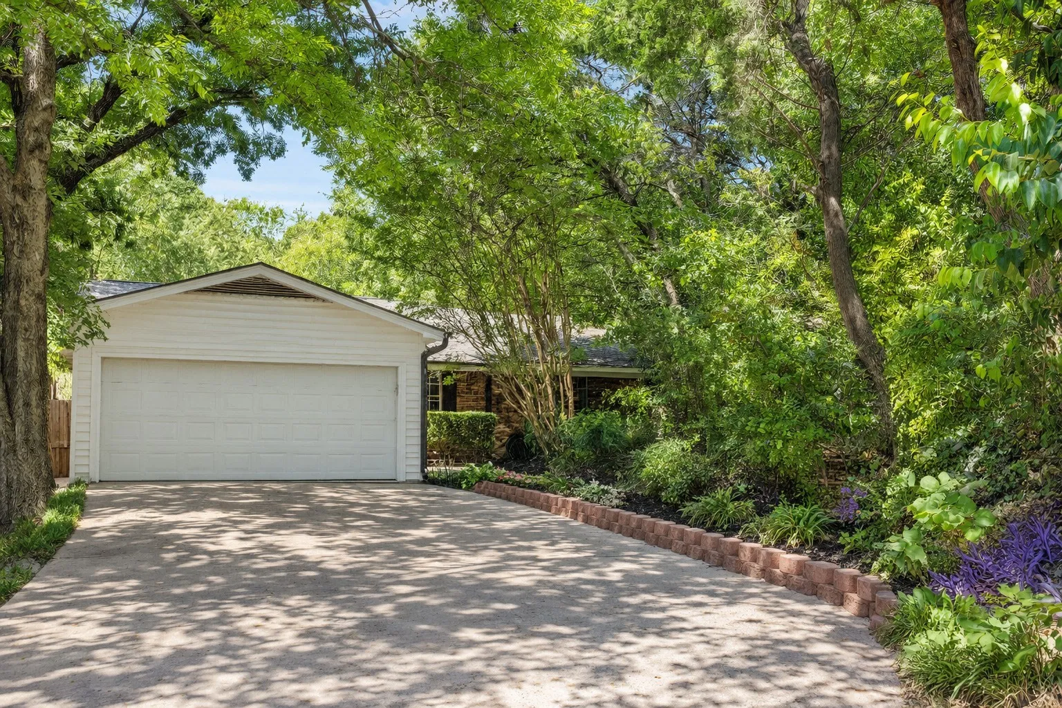 Welcome to this home shaded with mature trees.