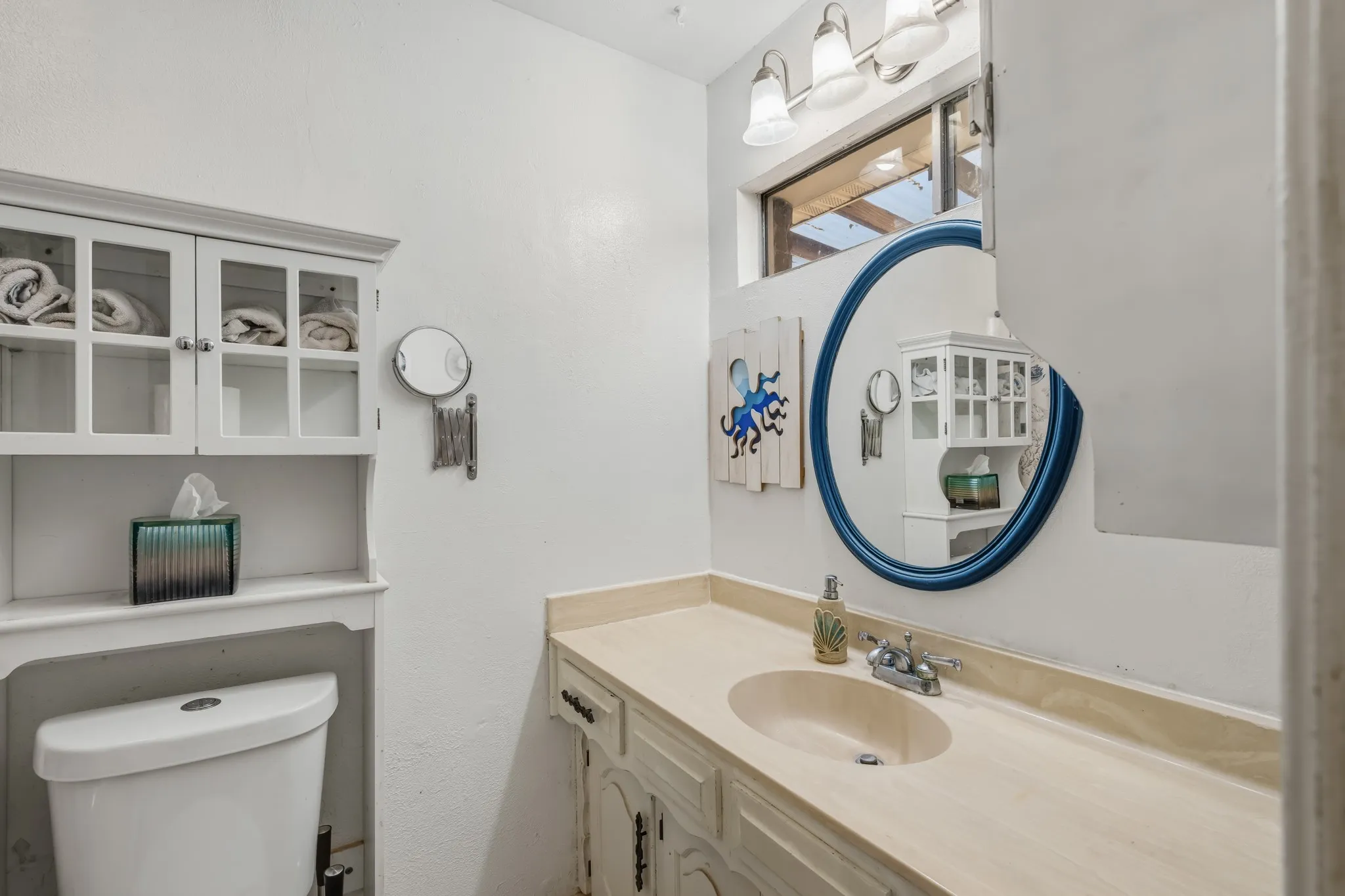 Good storage is found in this bathroom.