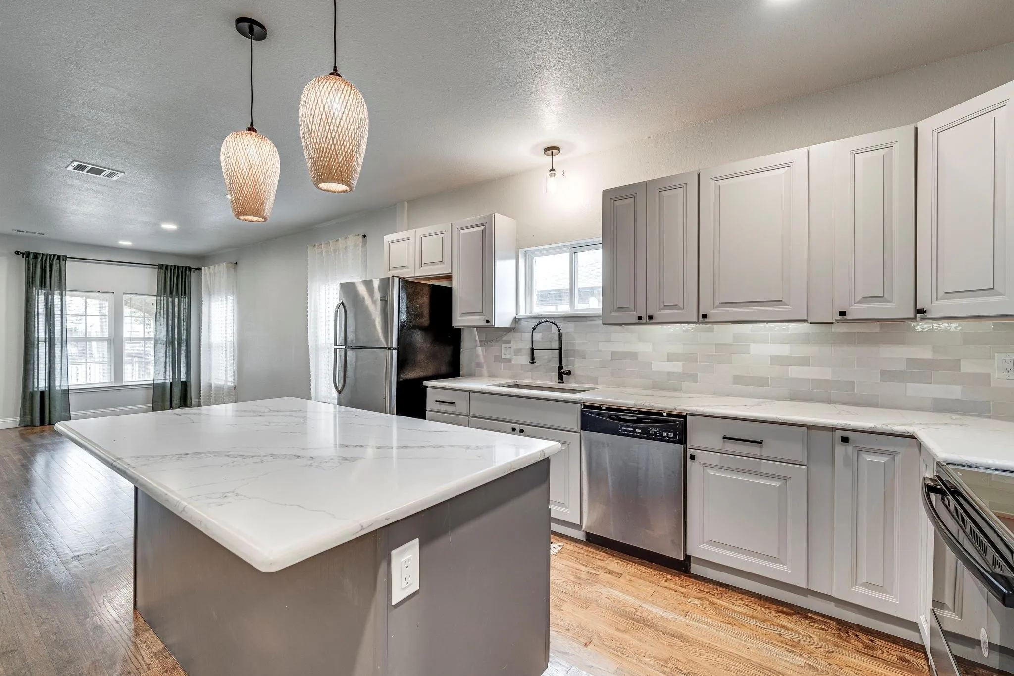 Refrigerator included. Large kitchen island. New lighting