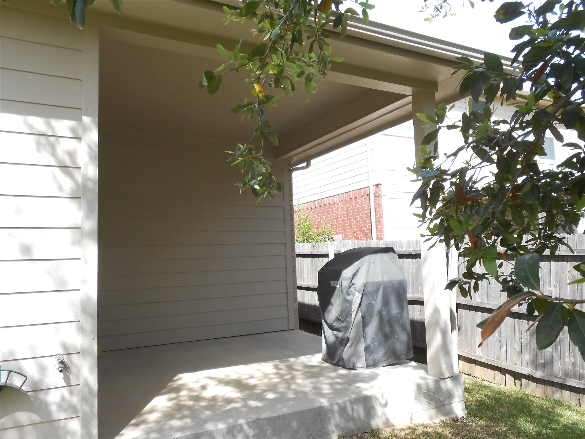 COVERED PATIO ON BACK OF HOUSE