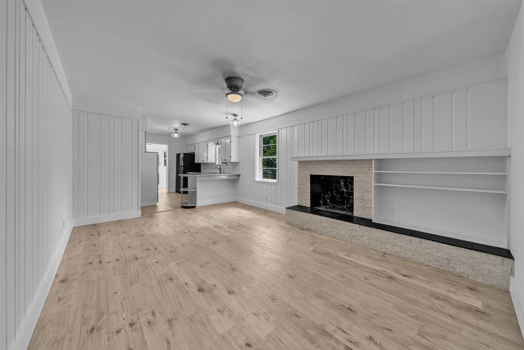 Comfortable Family Room with Fireplace Open to the Kitchen