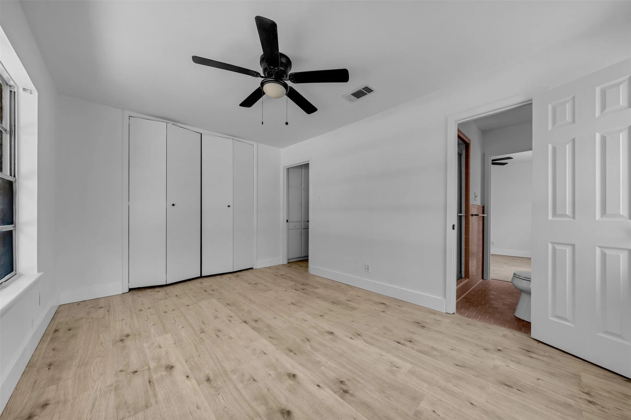 Front Bed Room with Large Closet and Access to Walk Through Bathroom