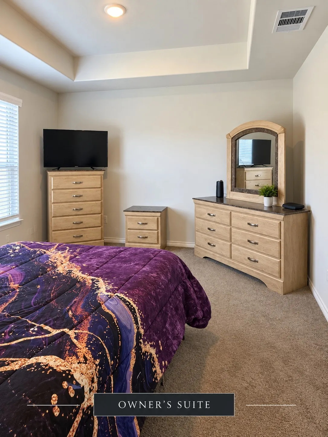 Tray ceiling with recessed lighting, wall-to-wall carpeting, and window with blinds