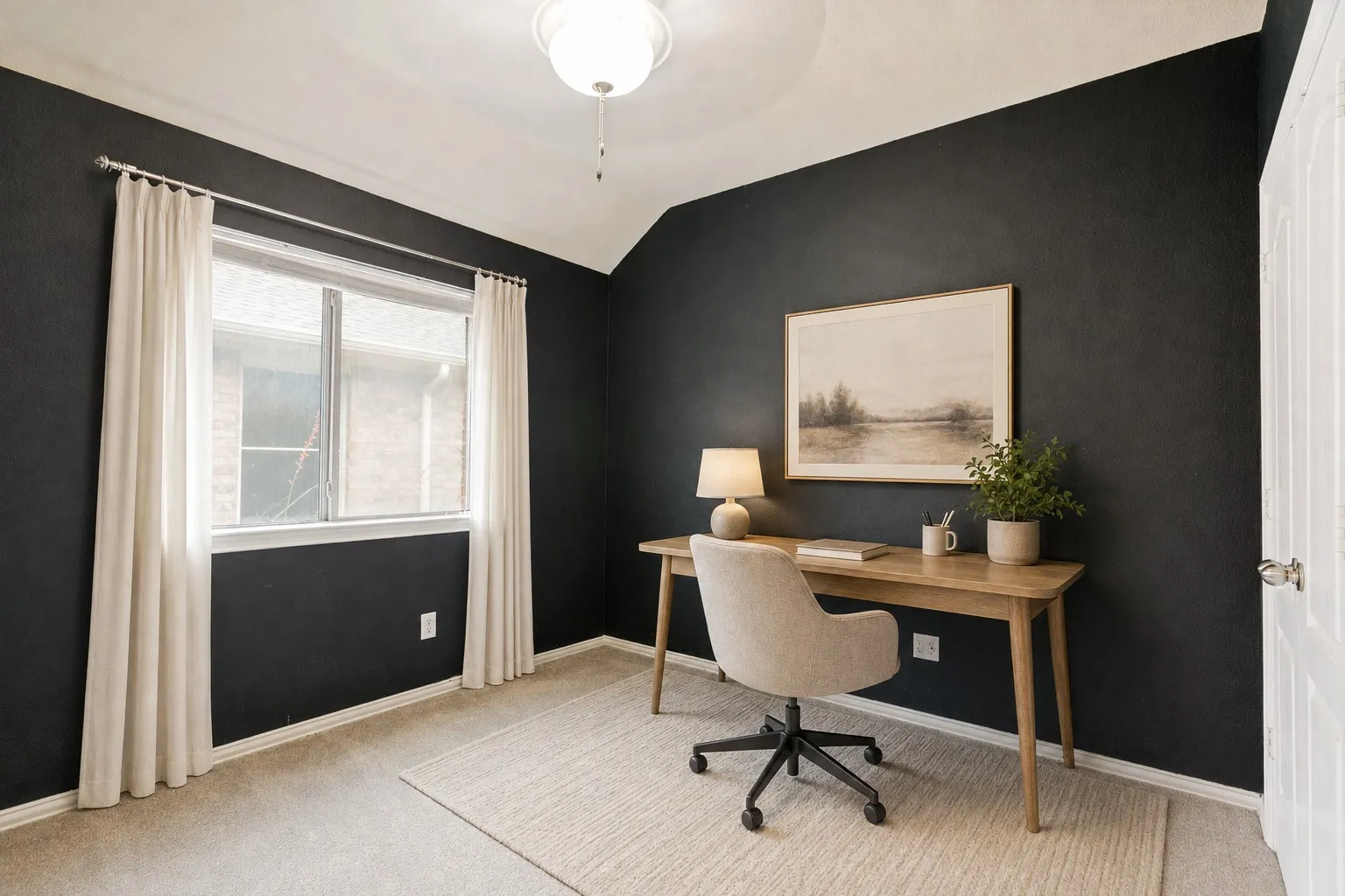 Vaulted ceiling with a flush-mount light fixture, a large window, dark accent wall, and neutral carpet flooring