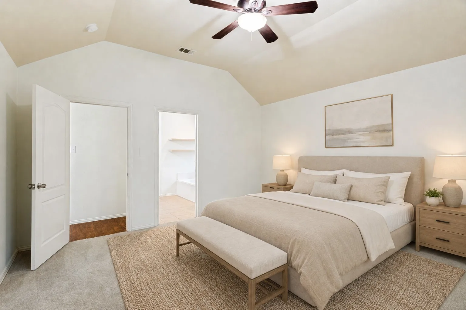 Vaulted ceiling with a ceiling fan, carpeted flooring, and a doorway to an additional room