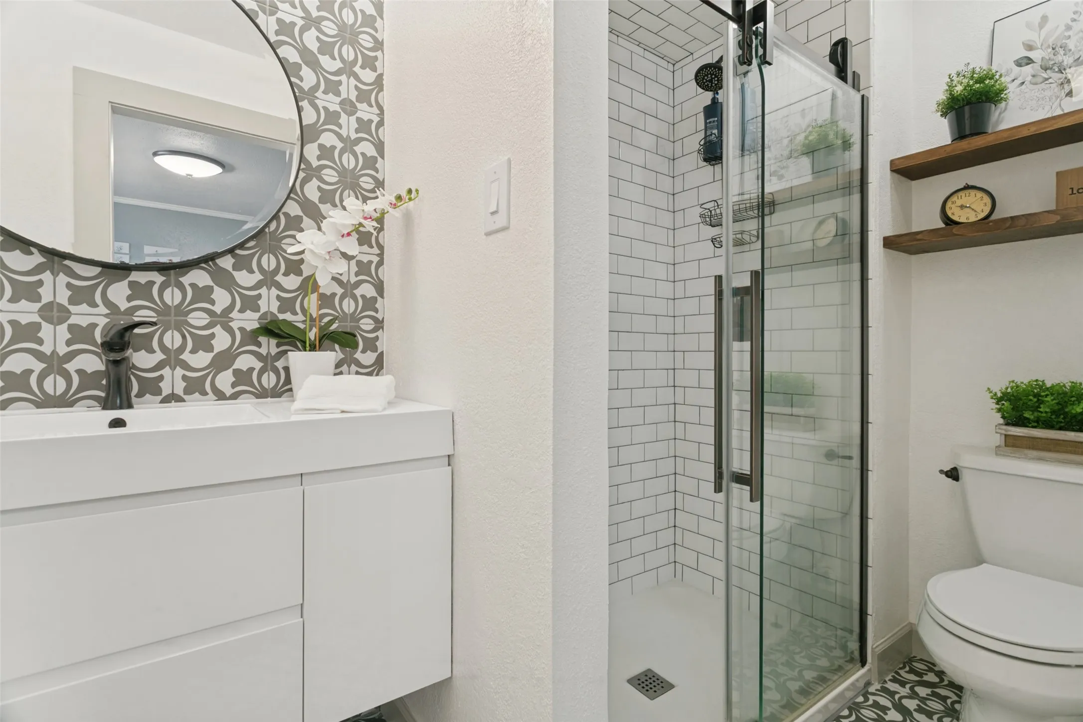 Complete remodel of your gorgeous master bathroom with decorative tile and an oversized shower.