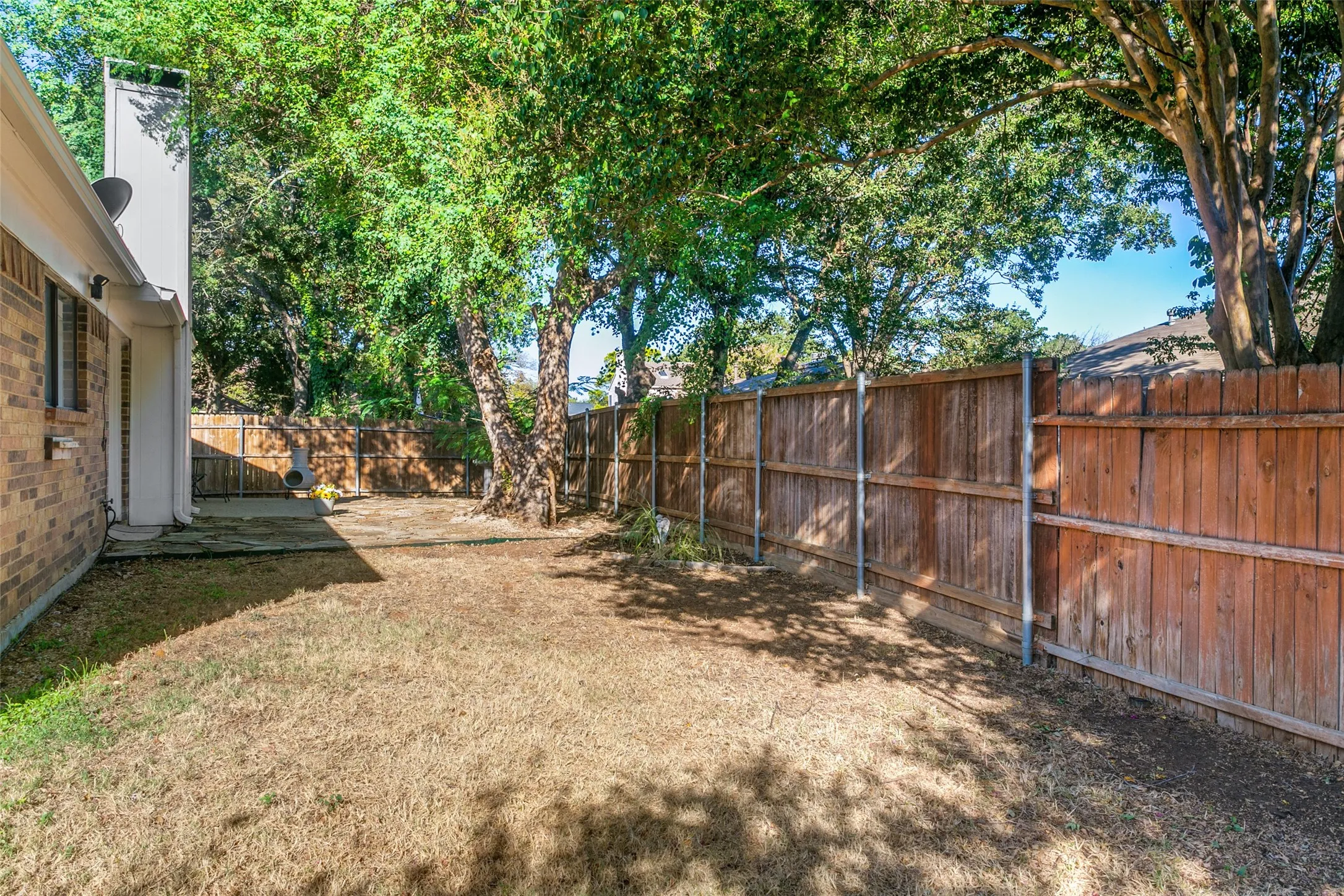 Another view of backyard. Plenty of room for your children or animals to play.